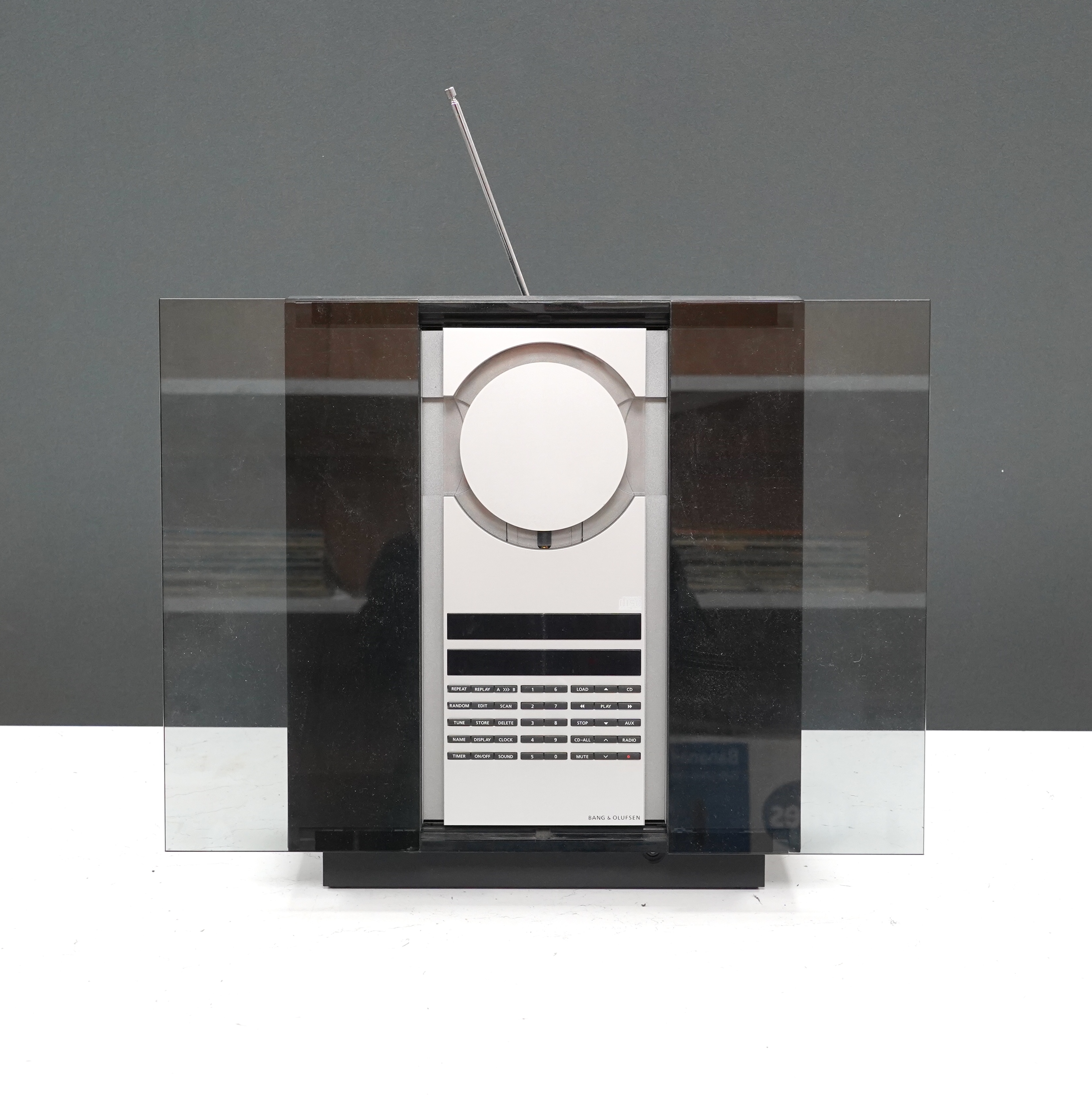 A Bang & Olufsen BeoSound 3000 CD player and music system, 37cm high, with instruction booklet, cables and remote control